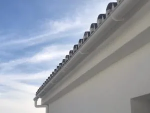 White guttering installed on a tiled Spanish roofline