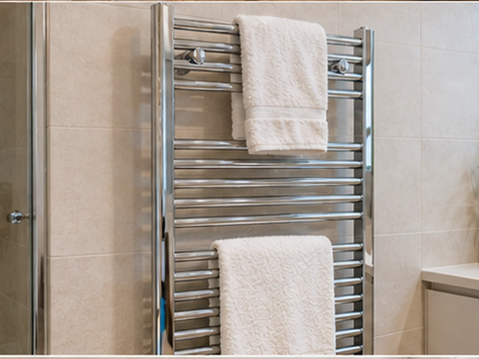 Wall-mounted heated towel rails for bathrooms