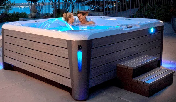 Hot tub installed beside an outdoor terrace